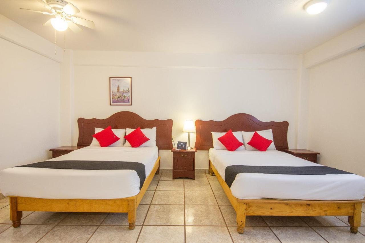 Capital O Hotel Suites Andrade ليون المظهر الخارجي الصورة