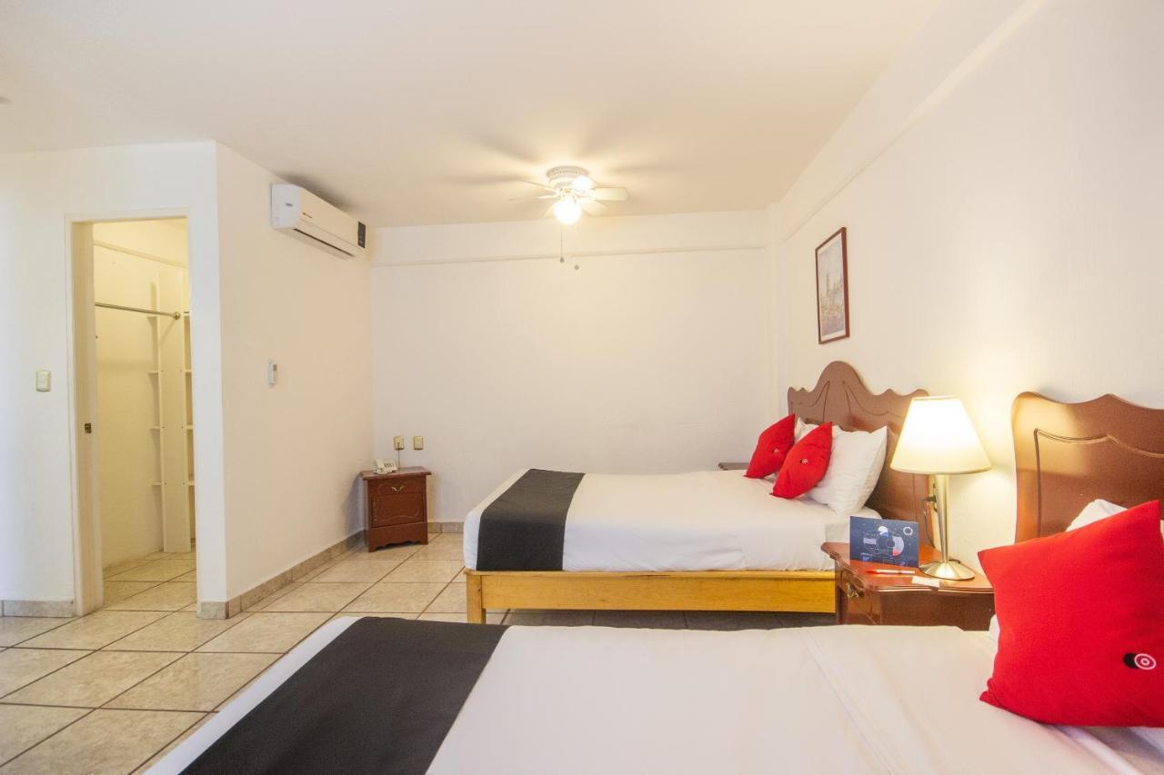 Capital O Hotel Suites Andrade ليون المظهر الخارجي الصورة
