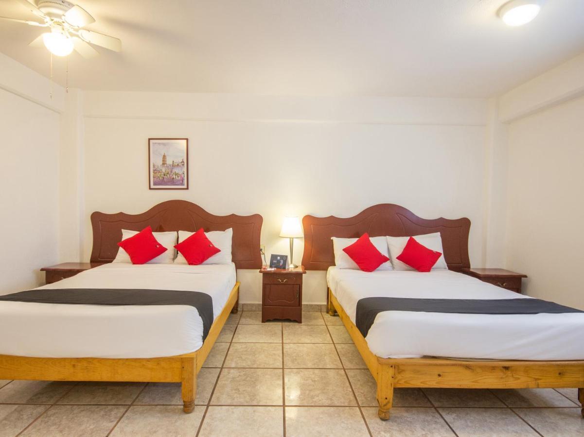 Capital O Hotel Suites Andrade ليون المظهر الخارجي الصورة